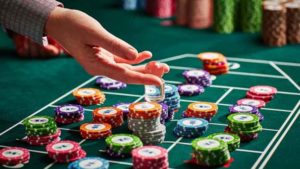 roulette player holding chips